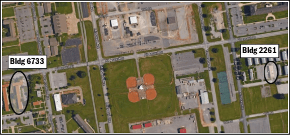 An aerial view of a park with a basketball court.