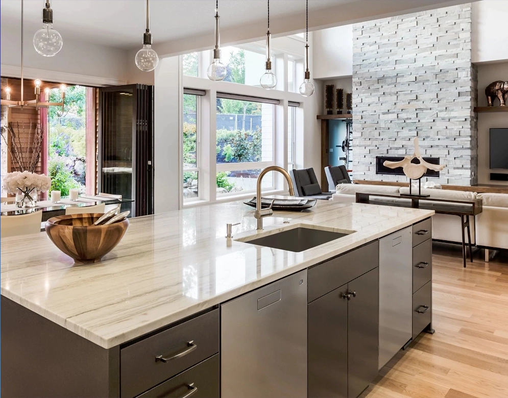 A kitchen with a sink and a large island